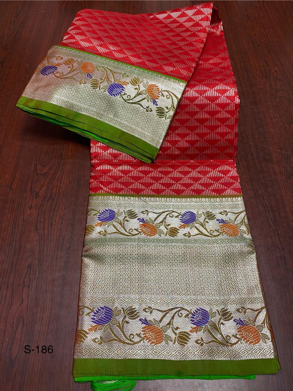 Beautiful red and green combination of pure Venkatagiri handloom Pattu saree with a 12-inch border.