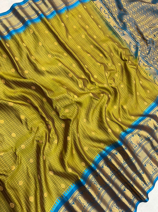 Beautiful mustard yellow and blue combination of pure Gadwal handloom with checks Pattu saree